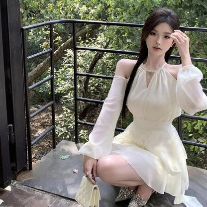 Apricotcolored Longsleeved Dress With A Cinched Waist Slimming Effect And Ethereal Ruffled Hem