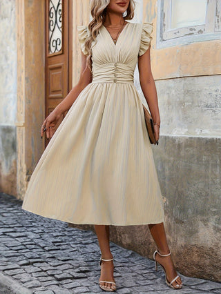 Elegant Solid-color Dress For Women Featuring Ruffled Cuffs And A Fitted Waistline